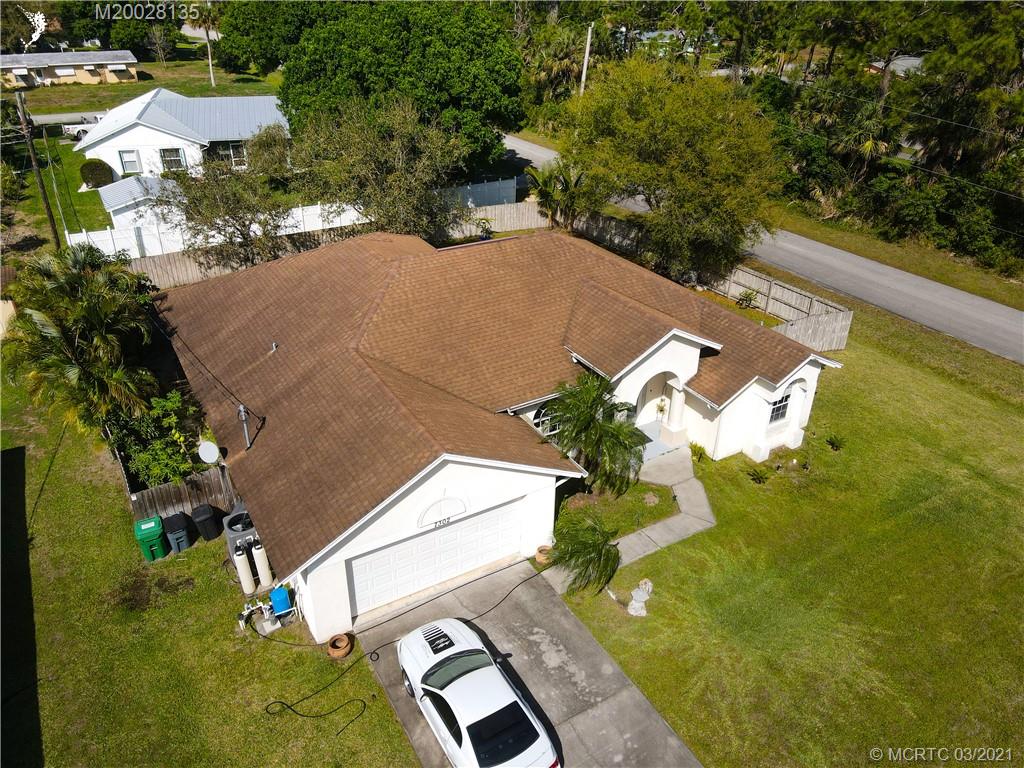 7302 Santa Rosa Parkway Fort Pierce, FL 34951 - Photo 6 of 33 an aerial view of a house with a yard basket ball court and outdoor seating
