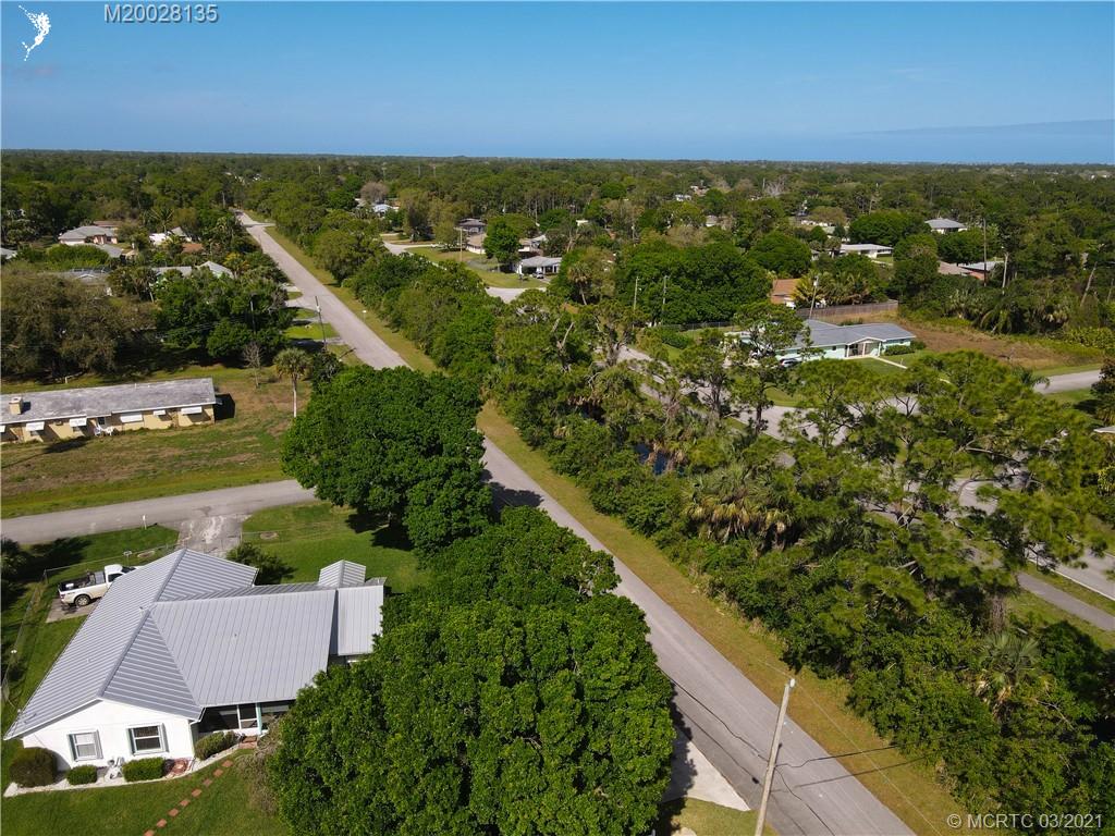 7302 Santa Rosa Parkway Fort Pierce, FL 34951 - Photo 10 of 33 an aerial view of residential houses with outdoor space and ocean view
