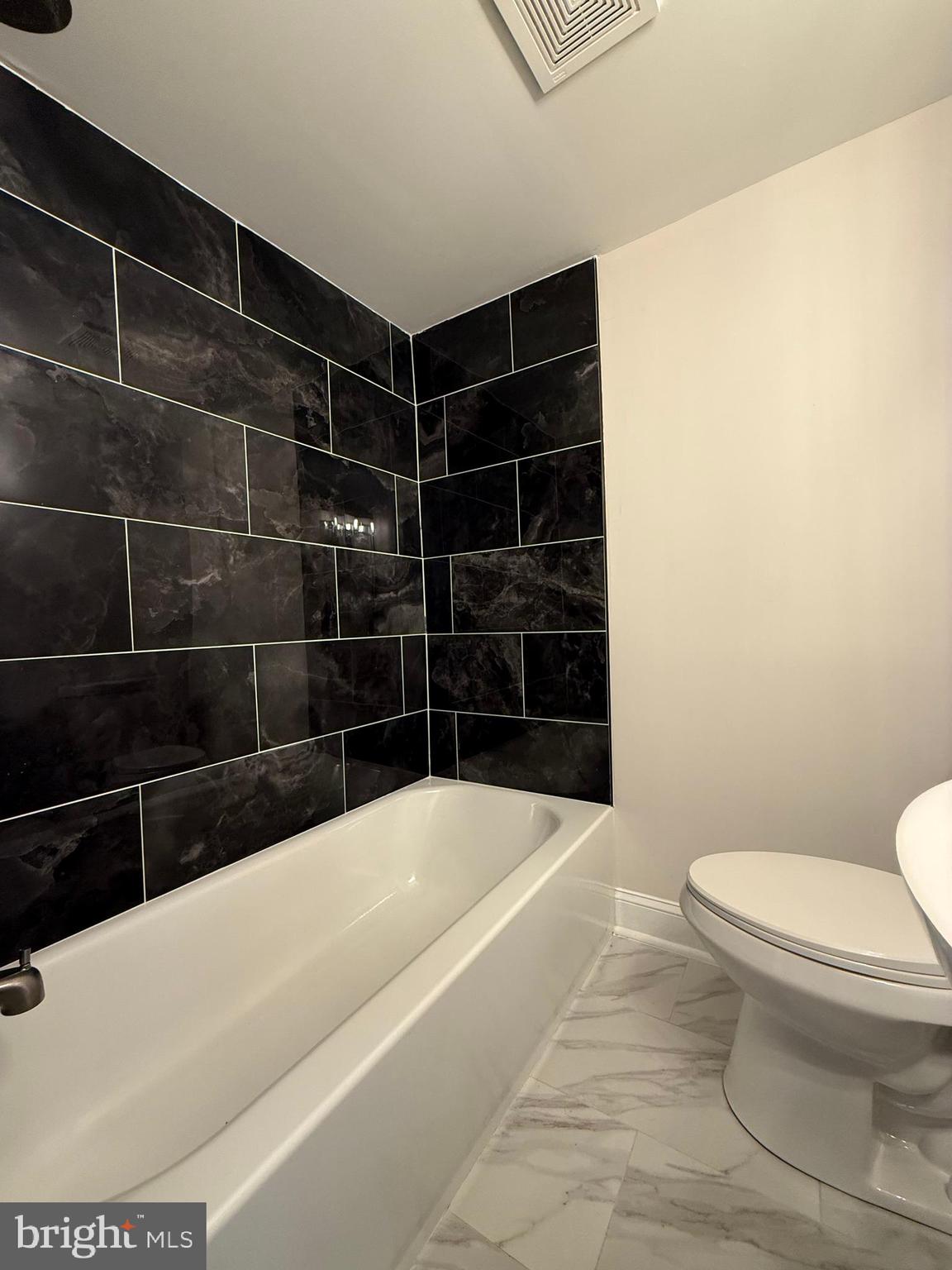 1263 South Merrimac Road Camden, NJ 08104 - Photo 13 of 16 a bathroom with a bathtub and toilet