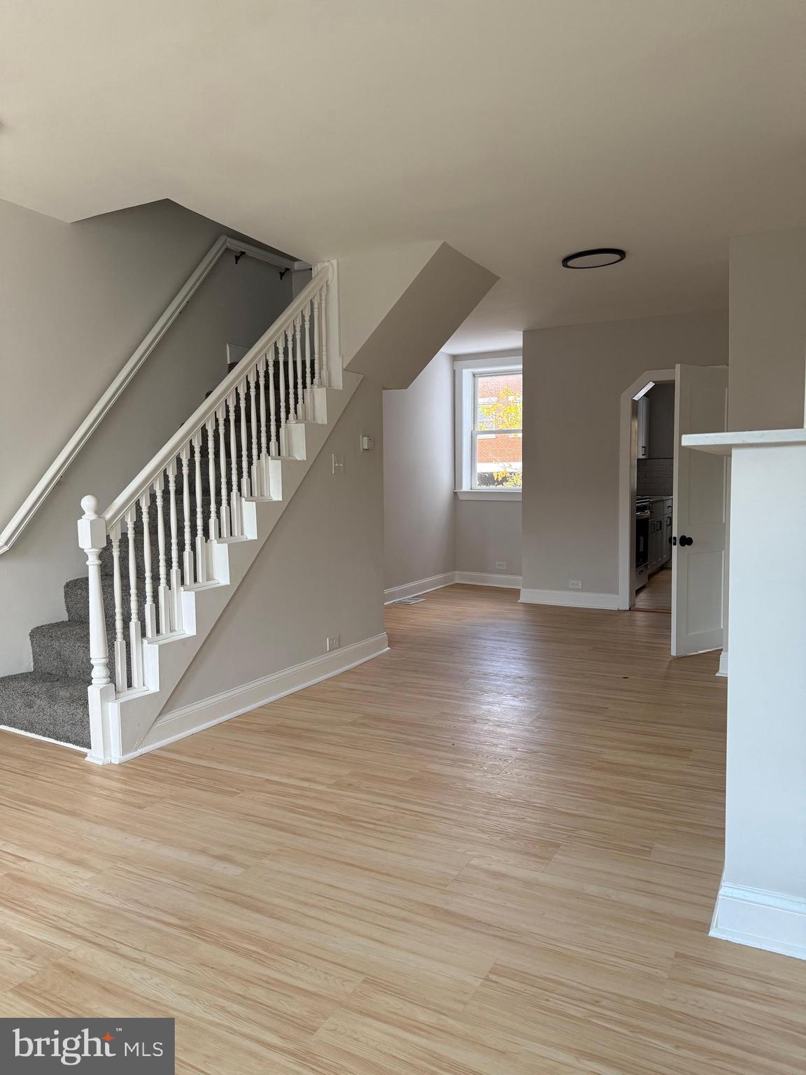 1263 South Merrimac Road Camden, NJ 08104 - Photo 4 of 16 a view of hallway with stairs and wooden floor