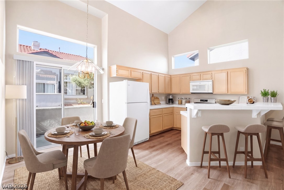 2232 Ramsgate Drive Henderson, NV 89074 - Photo 5 of 56 Virtually Staged Dining area off the open kitchen.