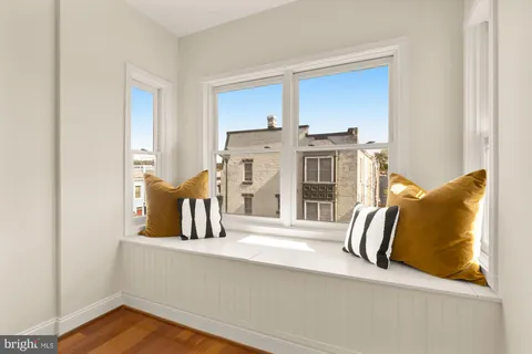 a bedroom with bed and window