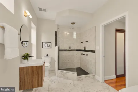 a bedroom with a bed and a table