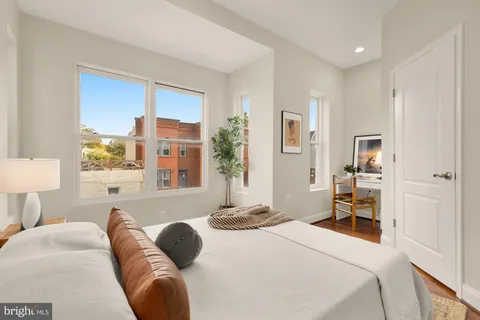 a dining room with a table and chairs