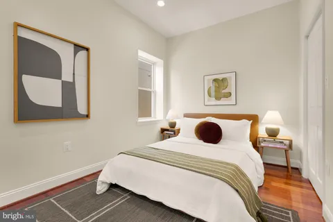 a bedroom with a bed and a couch