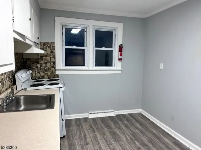 a kitchen with a sink and a stove