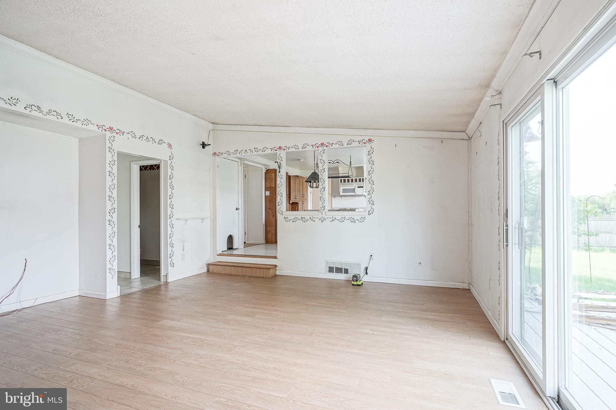 152 Kelly Driver Road Laurel Springs, NJ 08021 - Photo 15 of 30 a view of empty room with wooden floor and fan