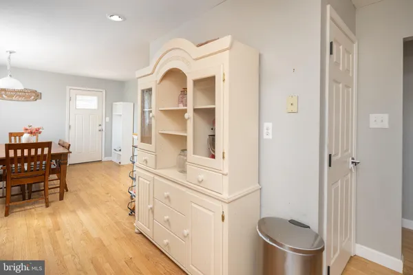 a view of living room with furniture and wooden floor