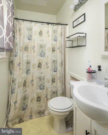 a bathroom with a toilet and a sink