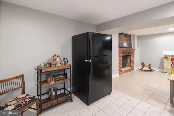a kitchen with stainless steel appliances kitchen island granite countertop a refrigerator and a stove top oven