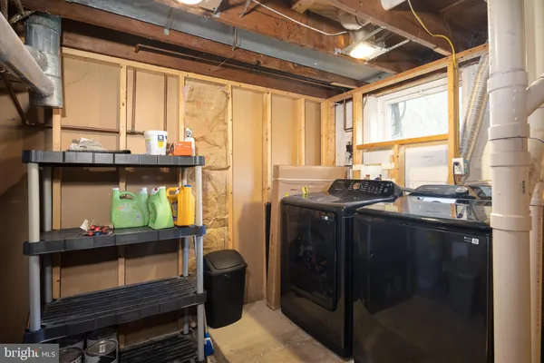 a kitchen with stainless steel appliances wooden cabinets and a stove top oven