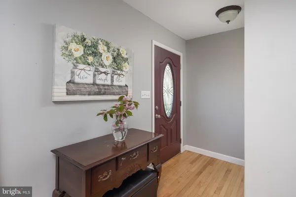 a view of a hallway with paintings on the wall
