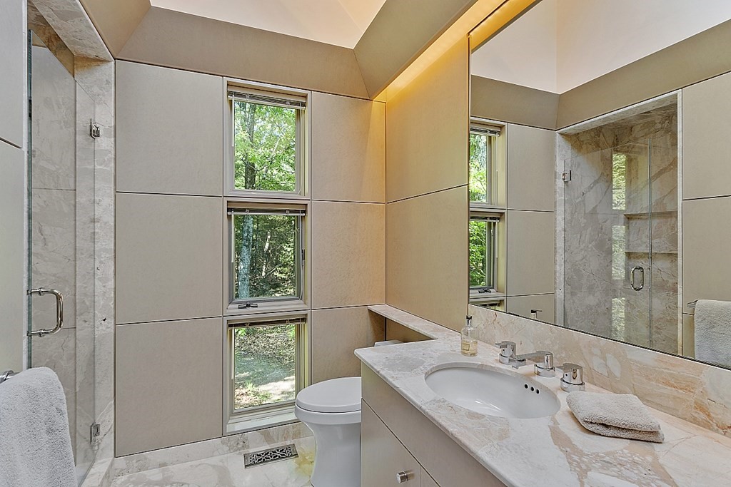 70 Davison Drive Lincoln, MA 01773 - Photo 16 of 37 a bathroom with a granite countertop sink toilet and shower
