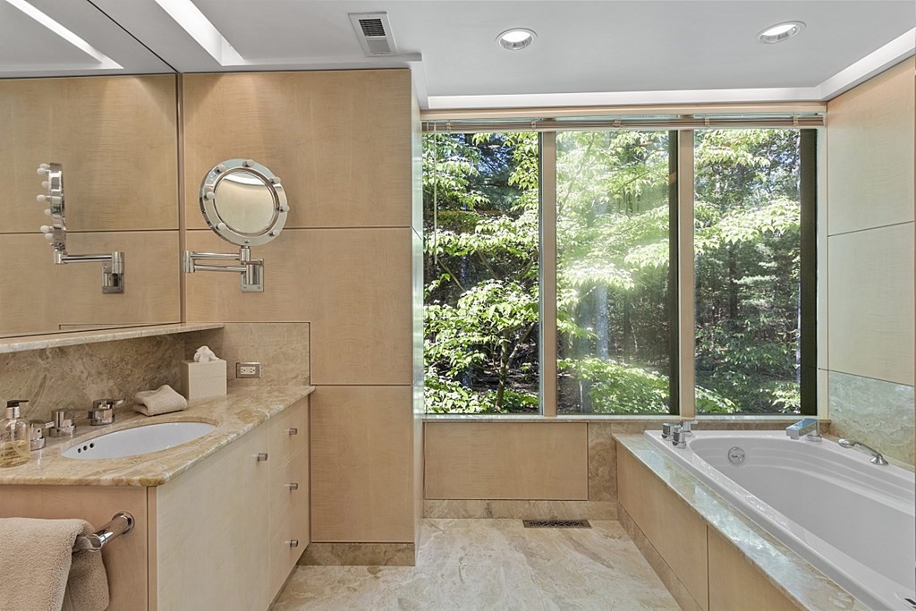 70 Davison Drive Lincoln, MA 01773 - Photo 17 of 37 a bathroom with a tub sink and mirror