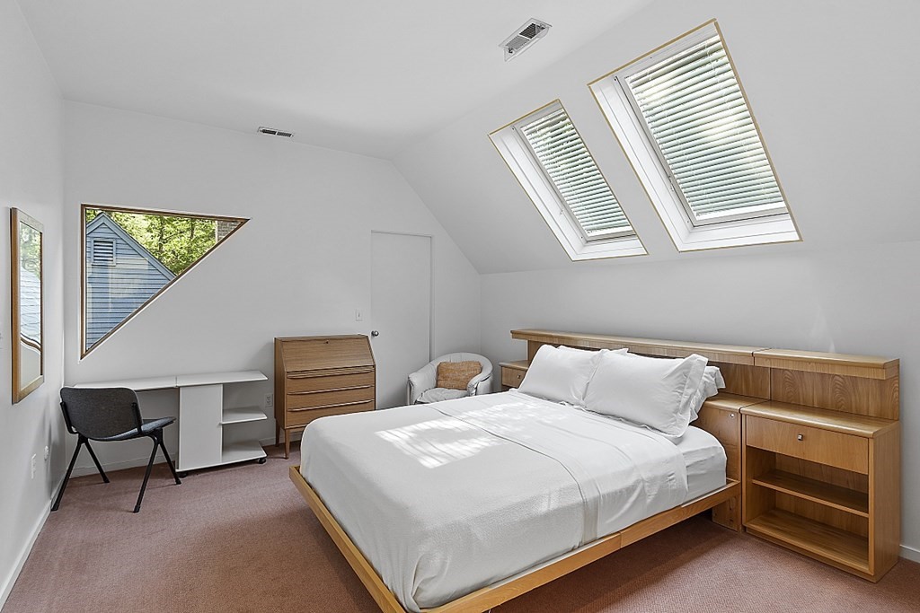 70 Davison Drive Lincoln, MA 01773 - Photo 19 of 37 a bedroom with a bed and a lamp on dresser