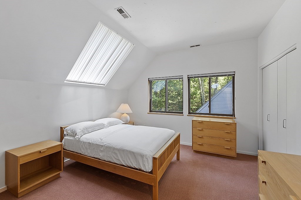 70 Davison Drive Lincoln, MA 01773 - Photo 20 of 37 a bedroom with a bed and a window