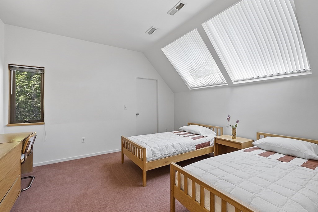 70 Davison Drive Lincoln, MA 01773 - Photo 21 of 37 a bedroom with two beds and a window