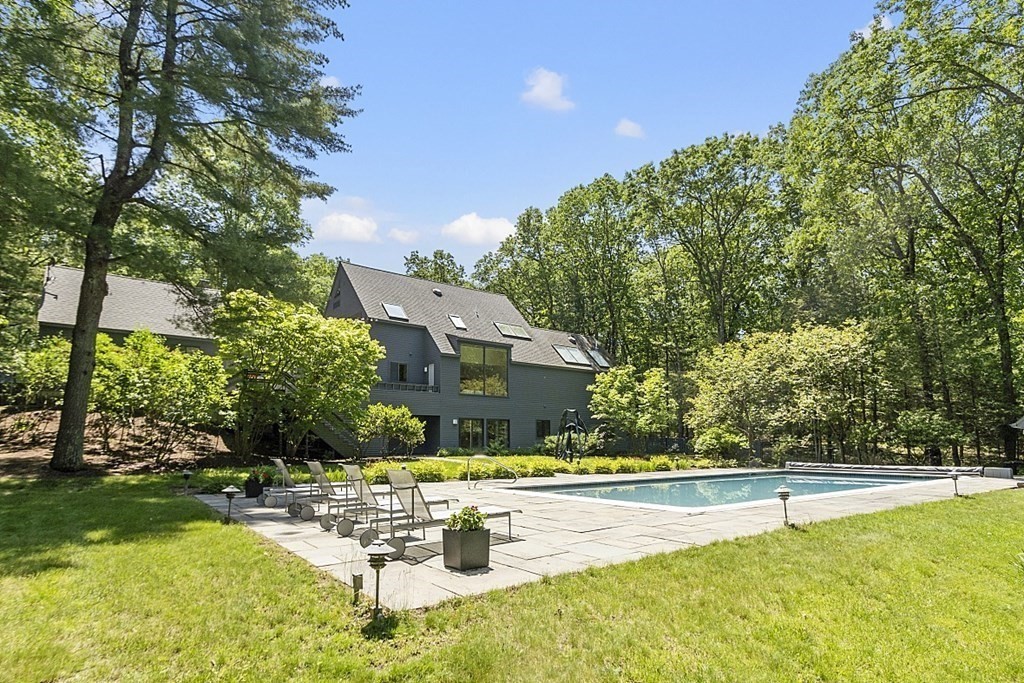 70 Davison Drive Lincoln, MA 01773 - Photo 33 of 37 a view of a swimming pool with lounge chair