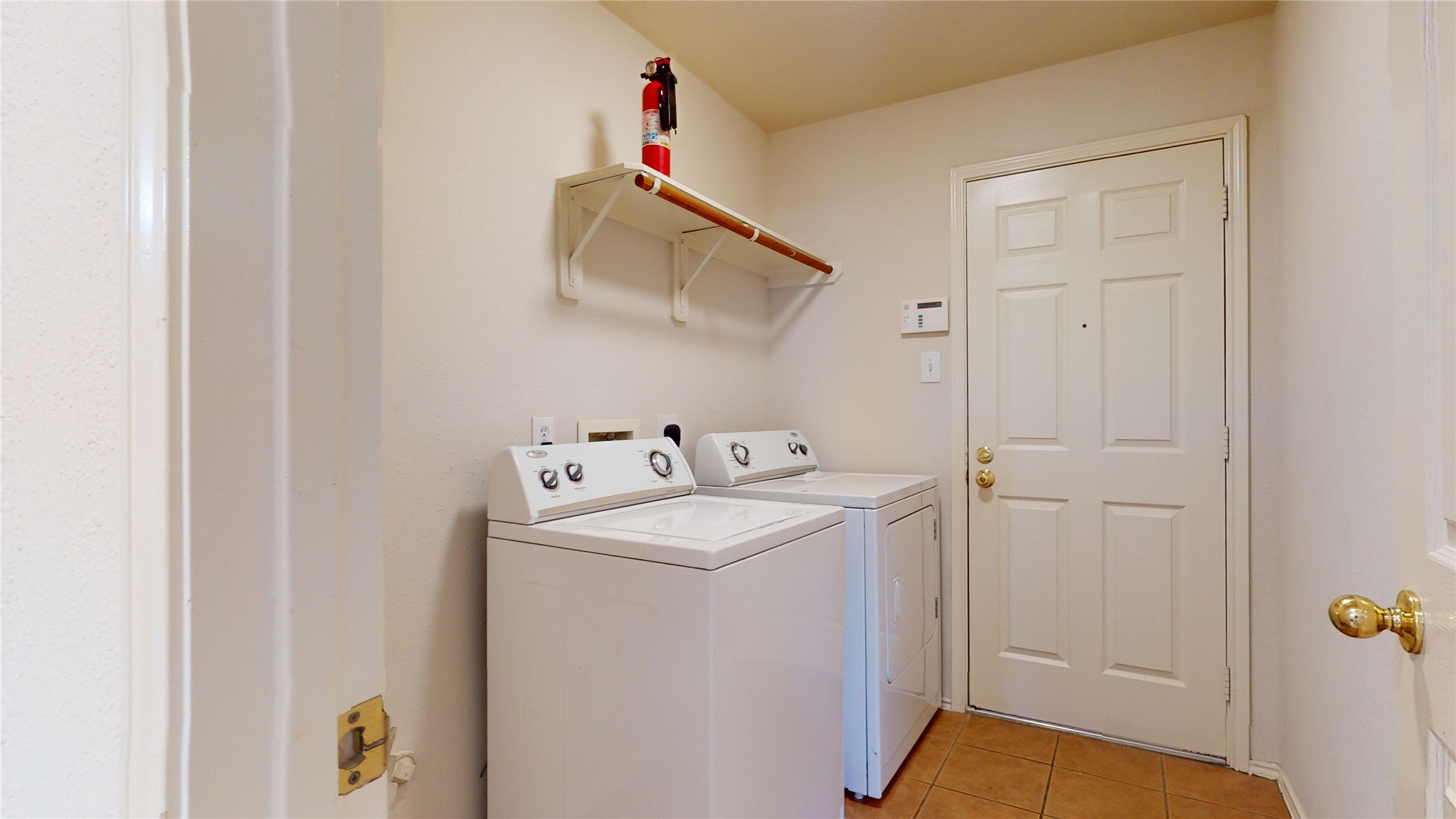 18226 Thicket Grove Road Houston, TX 77084 - Photo 16 of 45 a utility room with dryer and washer