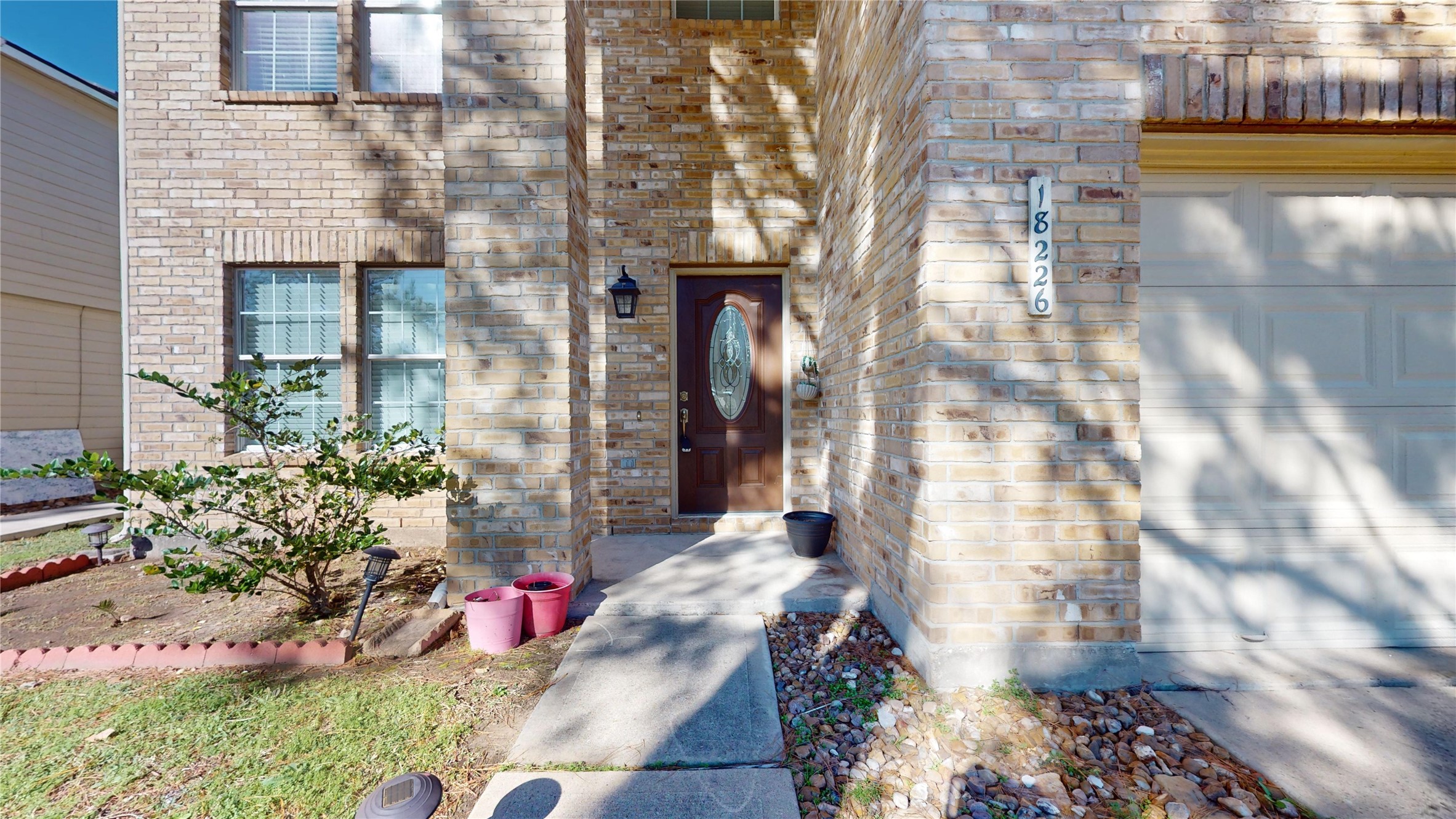 18226 Thicket Grove Road Houston, TX 77084 - Photo 2 of 45 a front view of a house with a yard