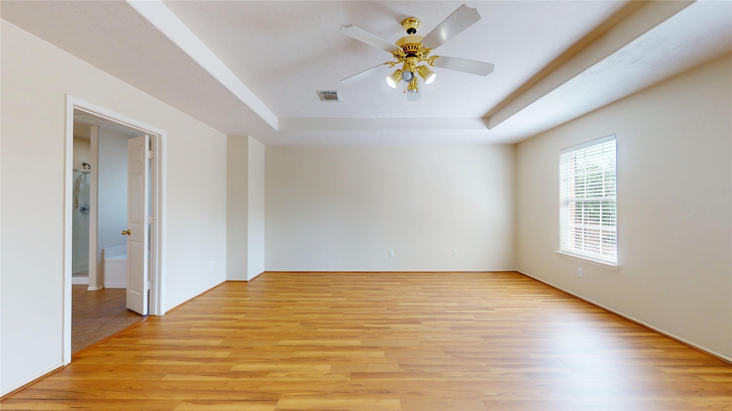 18226 Thicket Grove Road Houston, TX 77084 - Photo 22 of 45 a view of an empty room with a window