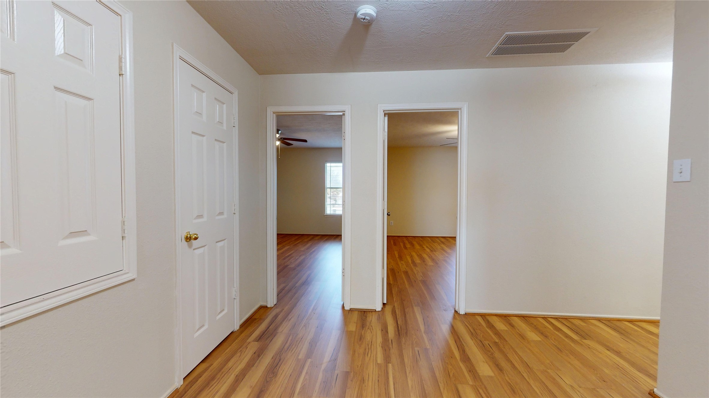 18226 Thicket Grove Road Houston, TX 77084 - Photo 30 of 45 a view of a hallway with wooden floor and staircase