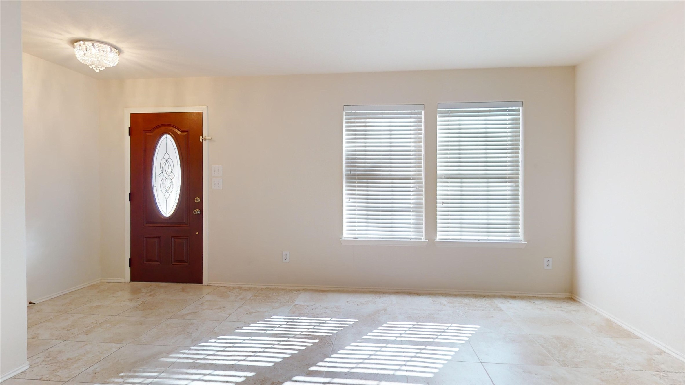 18226 Thicket Grove Road Houston, TX 77084 - Photo 3 of 45 a view of an empty room with a window and mirror door