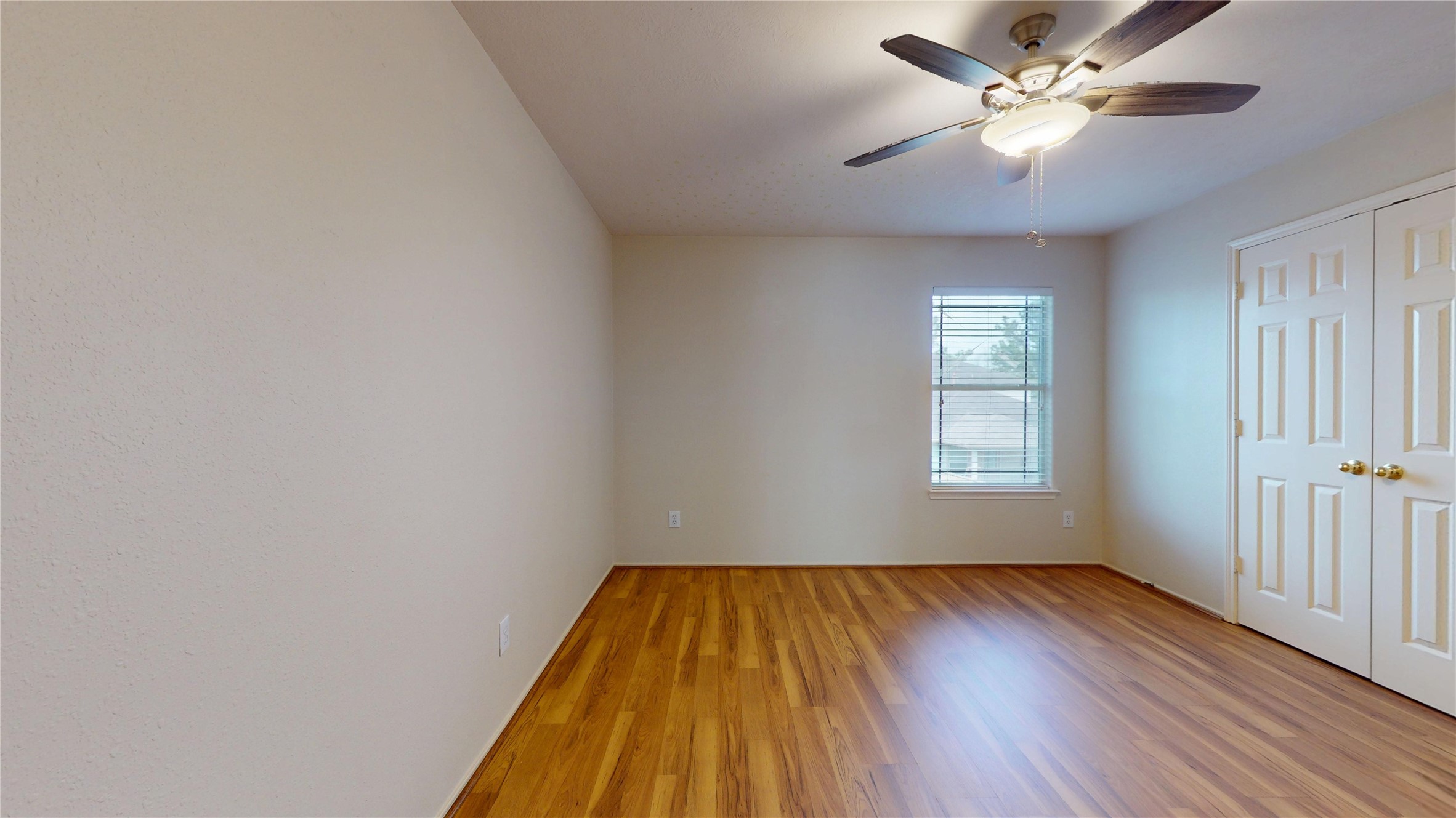 18226 Thicket Grove Road Houston, TX 77084 - Photo 33 of 45 wooden floor in an empty room with a window
