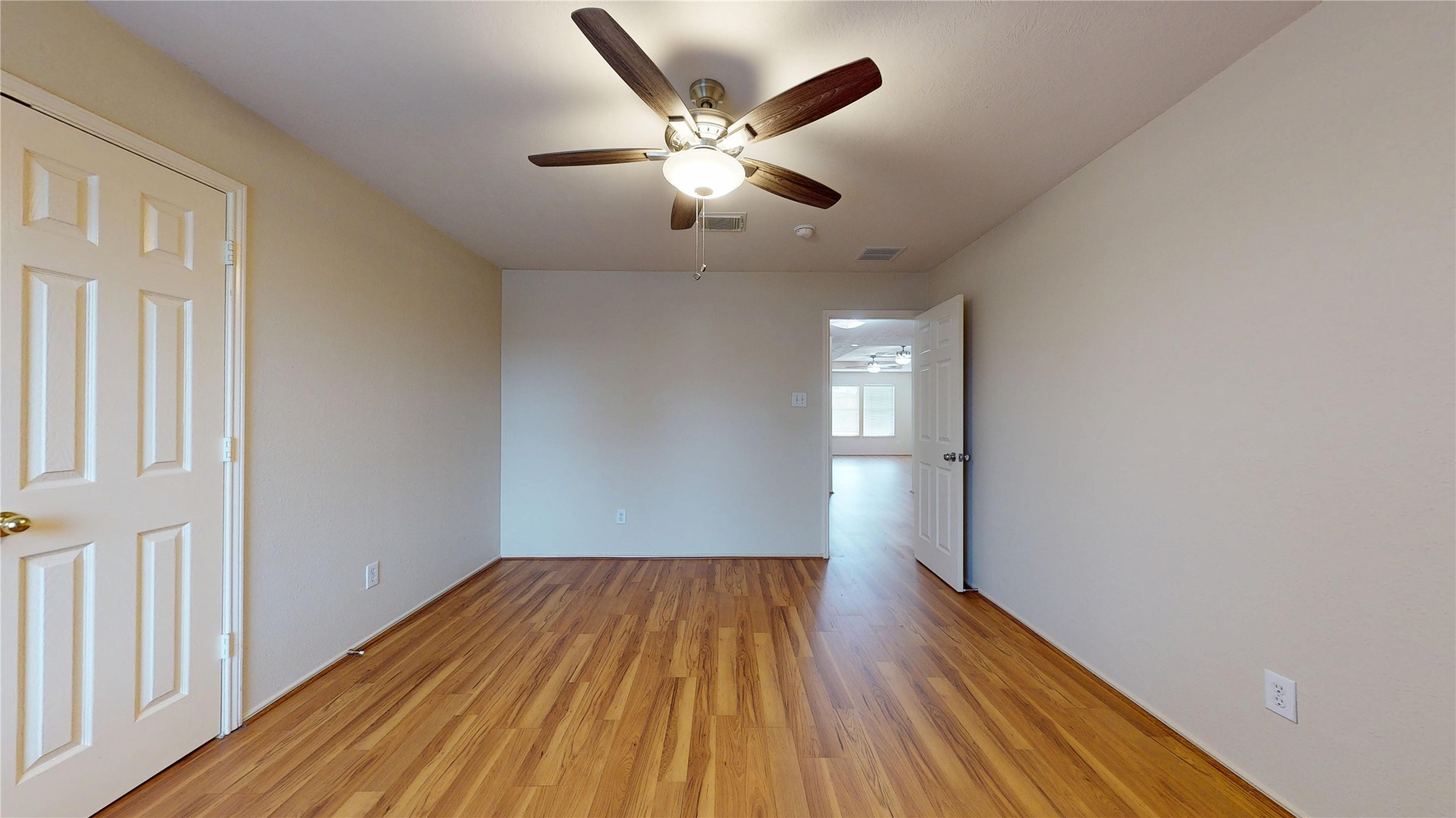 18226 Thicket Grove Road Houston, TX 77084 - Photo 35 of 45 wooden floor in an empty room with a window