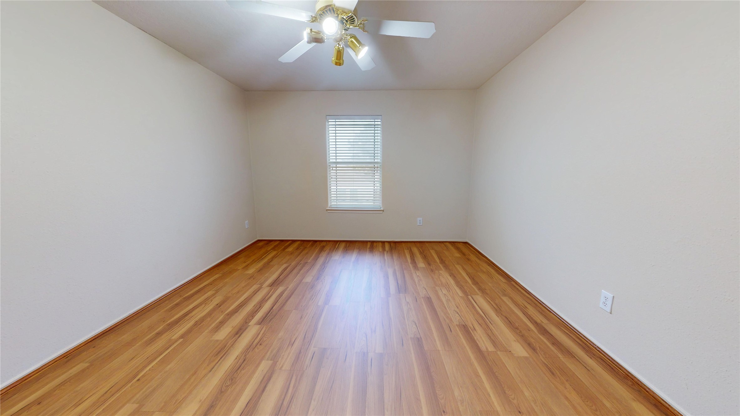 18226 Thicket Grove Road Houston, TX 77084 - Photo 38 of 45 wooden floor in an empty room with a window