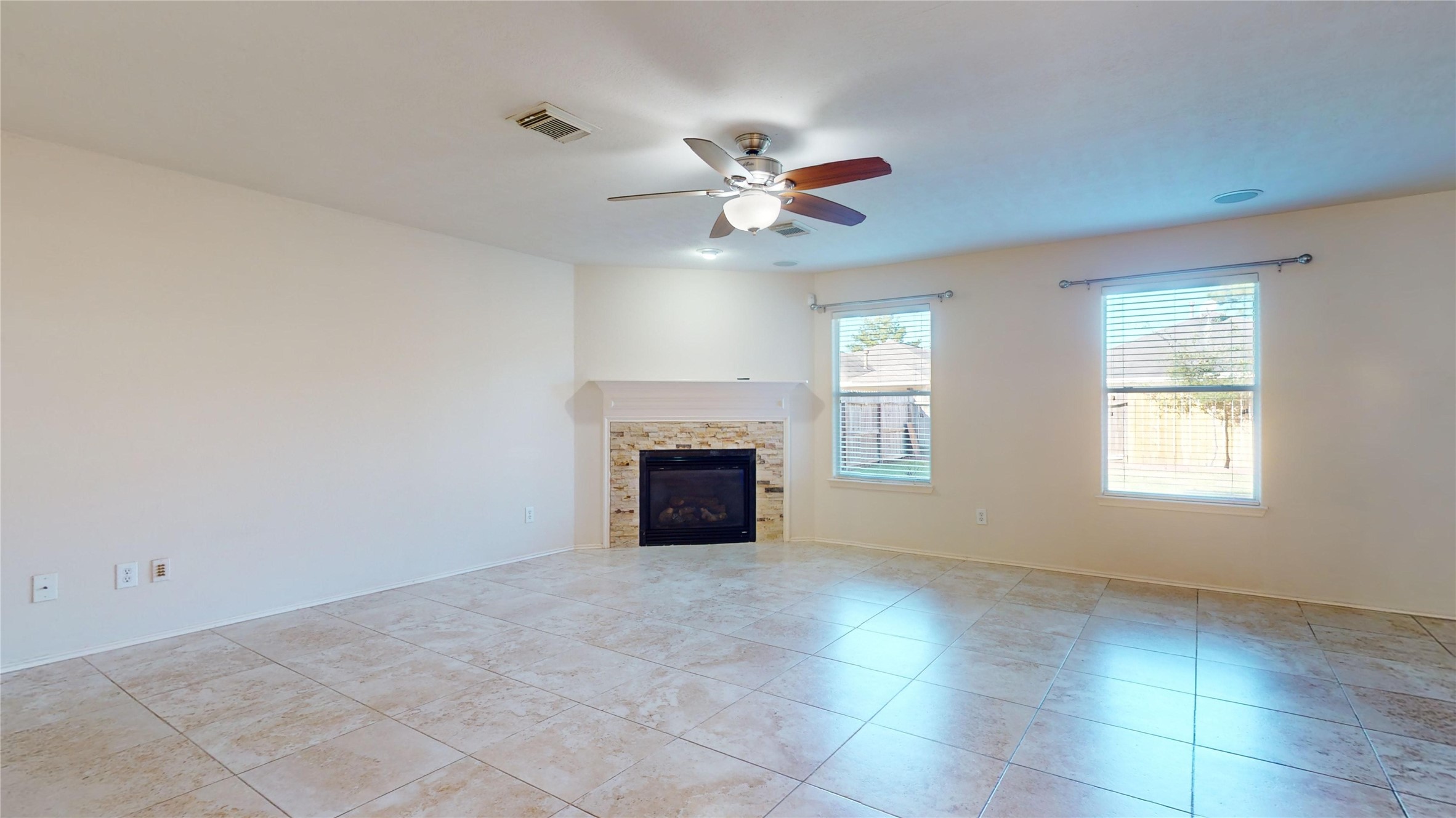 18226 Thicket Grove Road Houston, TX 77084 - Photo 7 of 45 a view of an empty room with a window