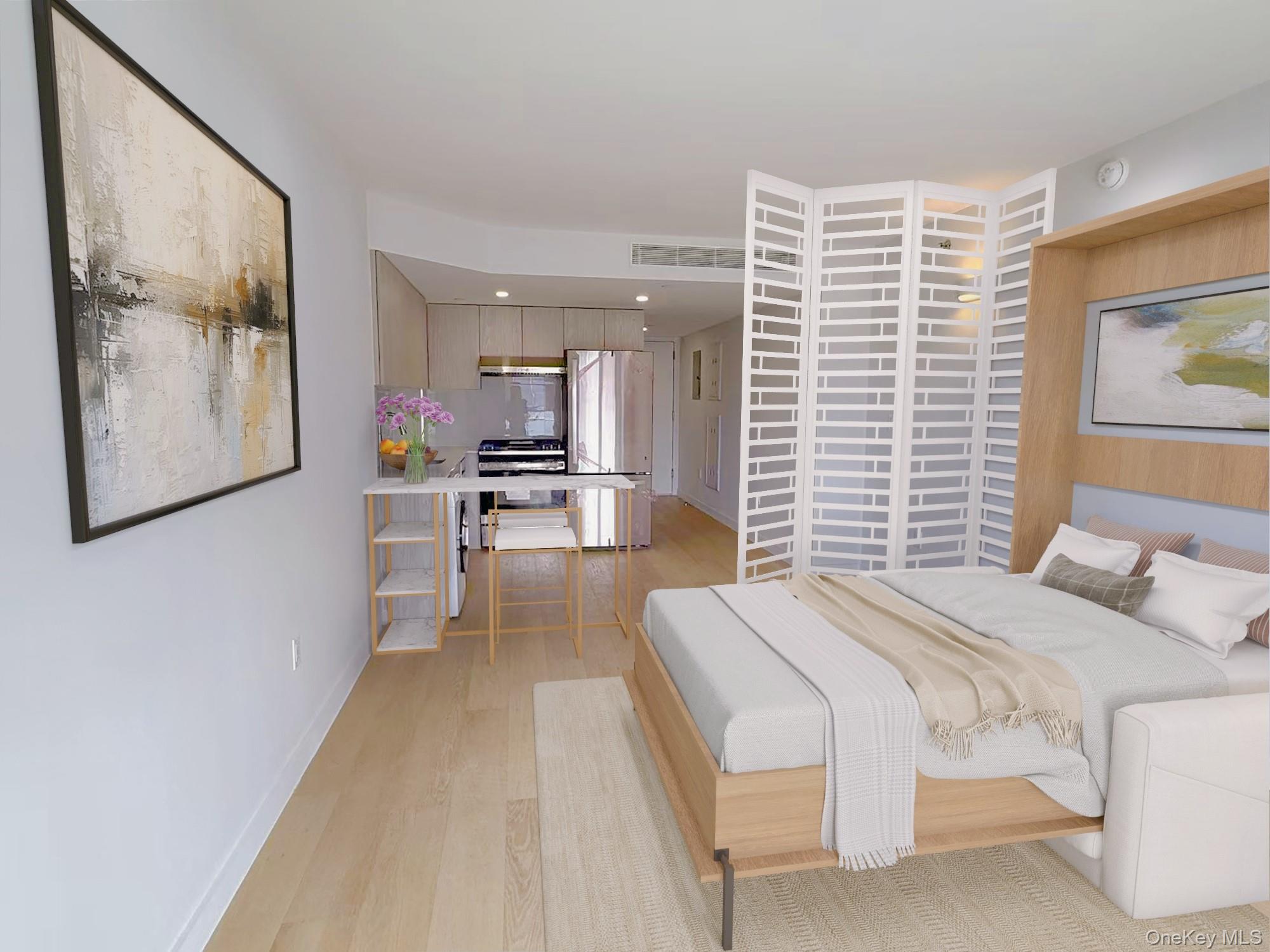 136-80 41st Avenue, Unit 7D Queens, NY 11355 - Photo 4 of 6 Bedroom featuring freestanding refrigerator, light wood-style floors, and recessed lighting