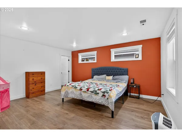 a bedroom with a bed and a table