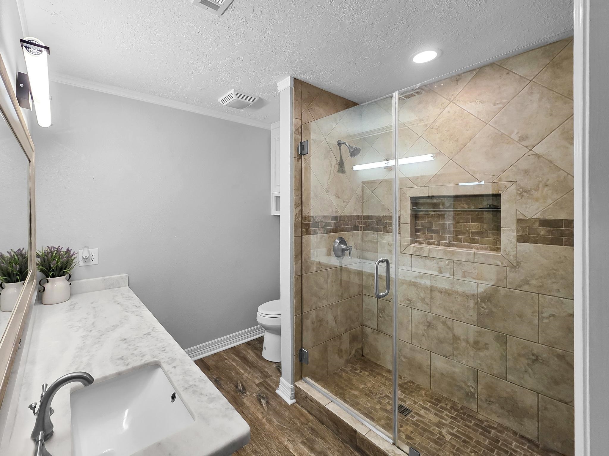 2641 Oilla Road Orange, TX 77630 - Photo 23 of 50 a bathroom with a sink and toilet