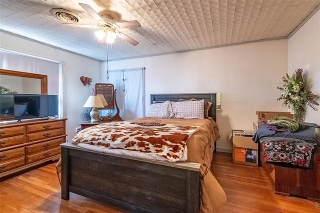 a bed room with furniture and a dresser