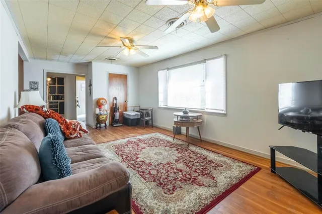 a living room with furniture and a rug