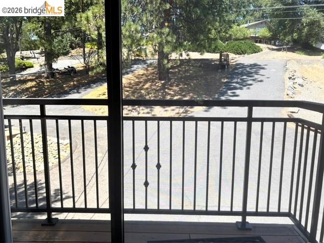 19711 Pleasantview Drive Groveland, CA 95321 - Photo 25 of 39 Private balcony featuring a wood-finish floor and black metal railing