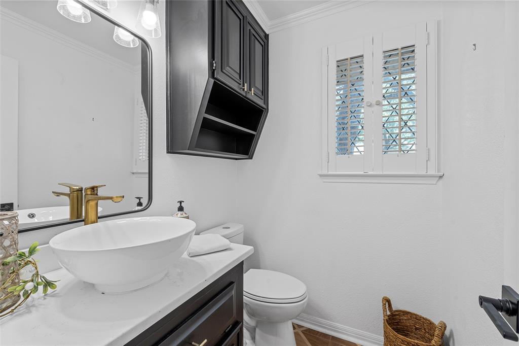 3000 Chimney Hill Drive Waco, TX 76708 - Photo 20 of 37 a bathroom with a granite countertop toilet a sink and a mirror
