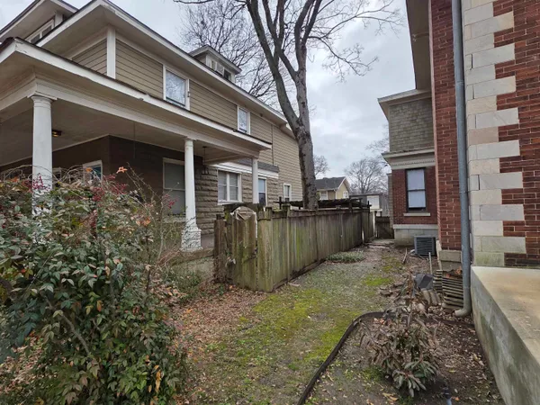 front view of a house with a garden