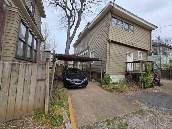 a car parked in front of a house