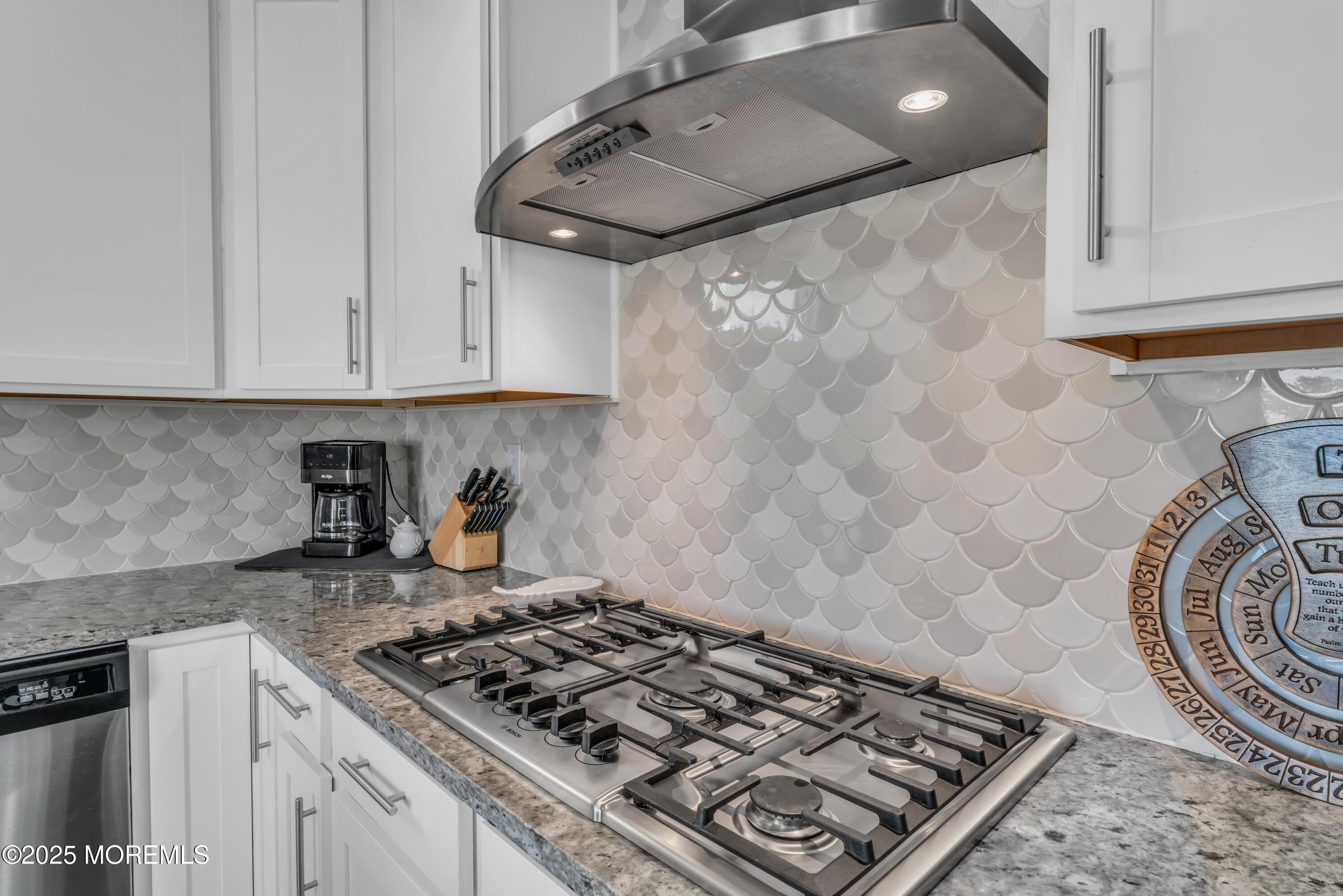 21 Compass Road Waretown, NJ 08758 - Photo 13 of 46 a kitchen with granite countertop a stove and a sink