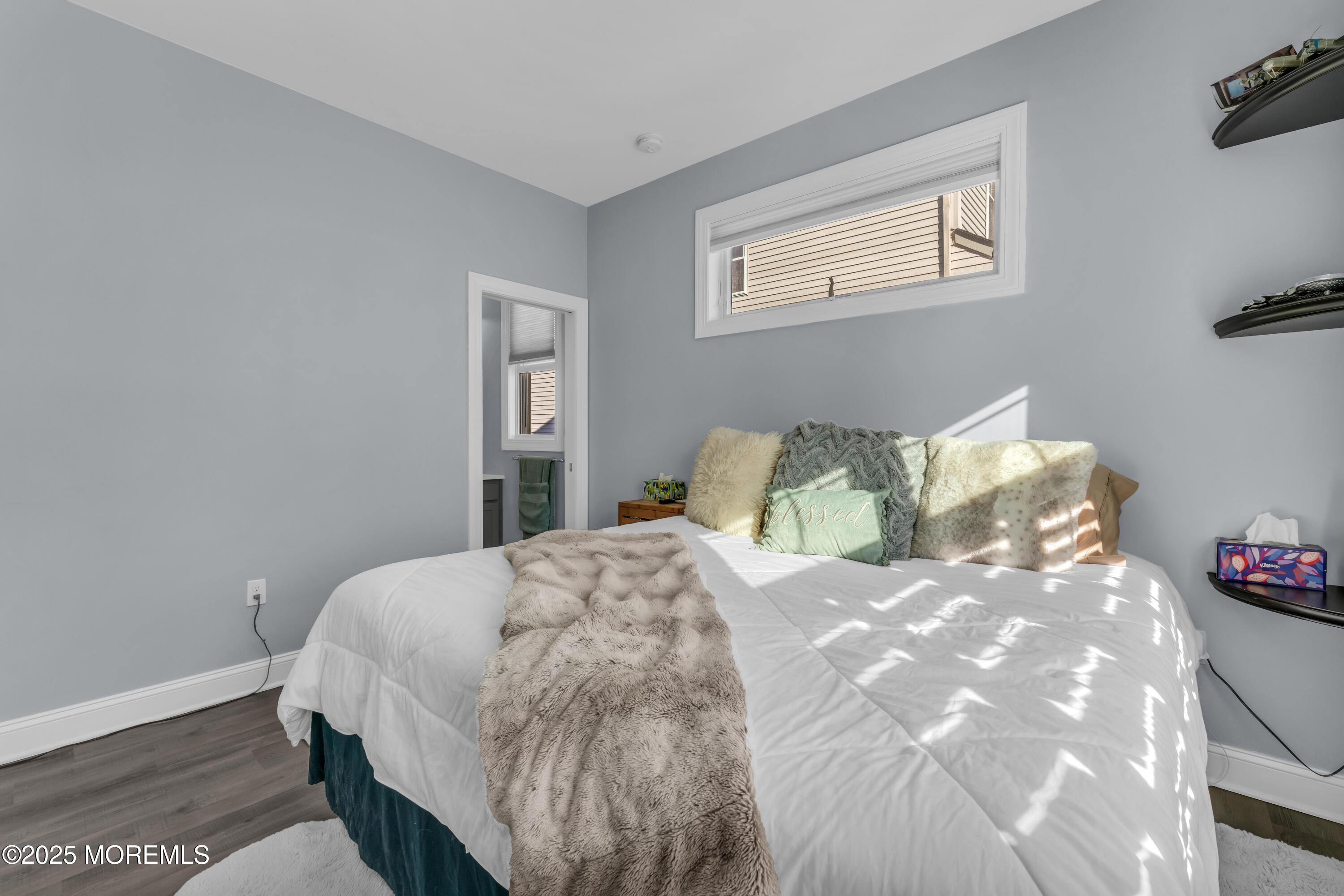 21 Compass Road Waretown, NJ 08758 - Photo 19 of 46 a large bed sitting in a bedroom next to a window