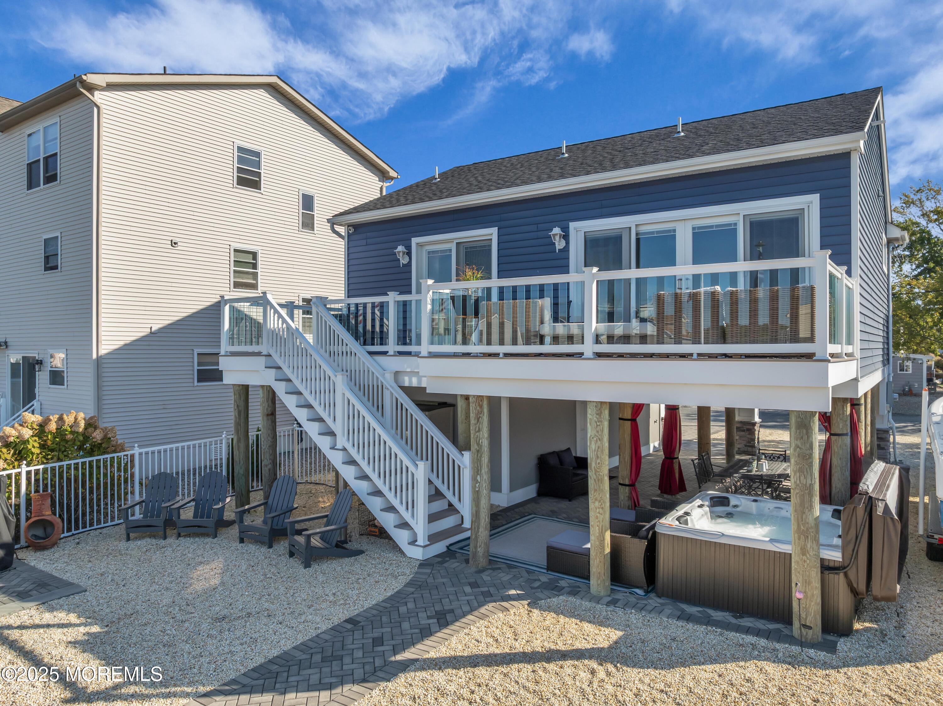 21 Compass Road Waretown, NJ 08758 - Photo 26 of 46 a view of a house with backyard and deck