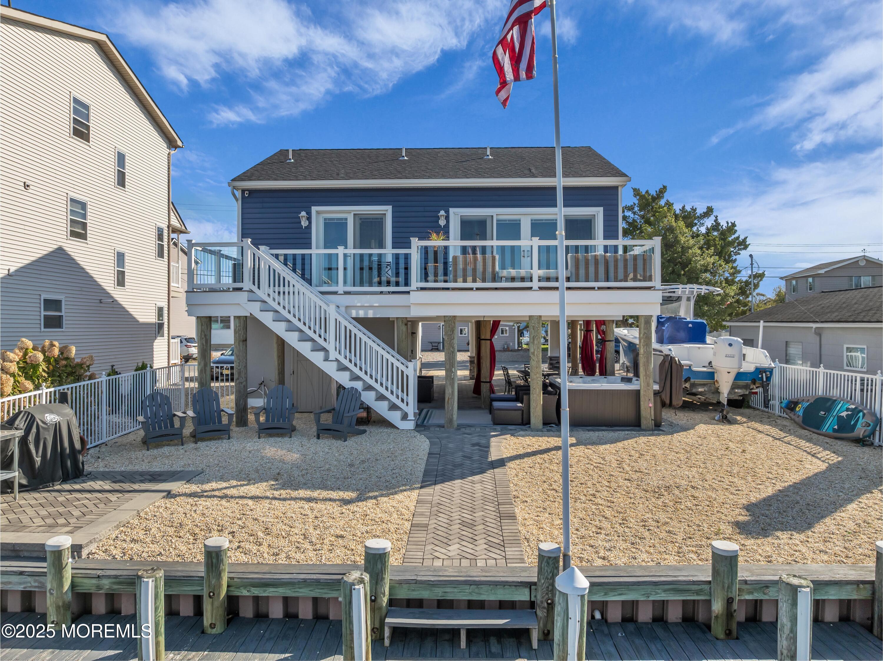 21 Compass Road Waretown, NJ 08758 - Photo 27 of 46 a view of a house with swimming pool and sitting area