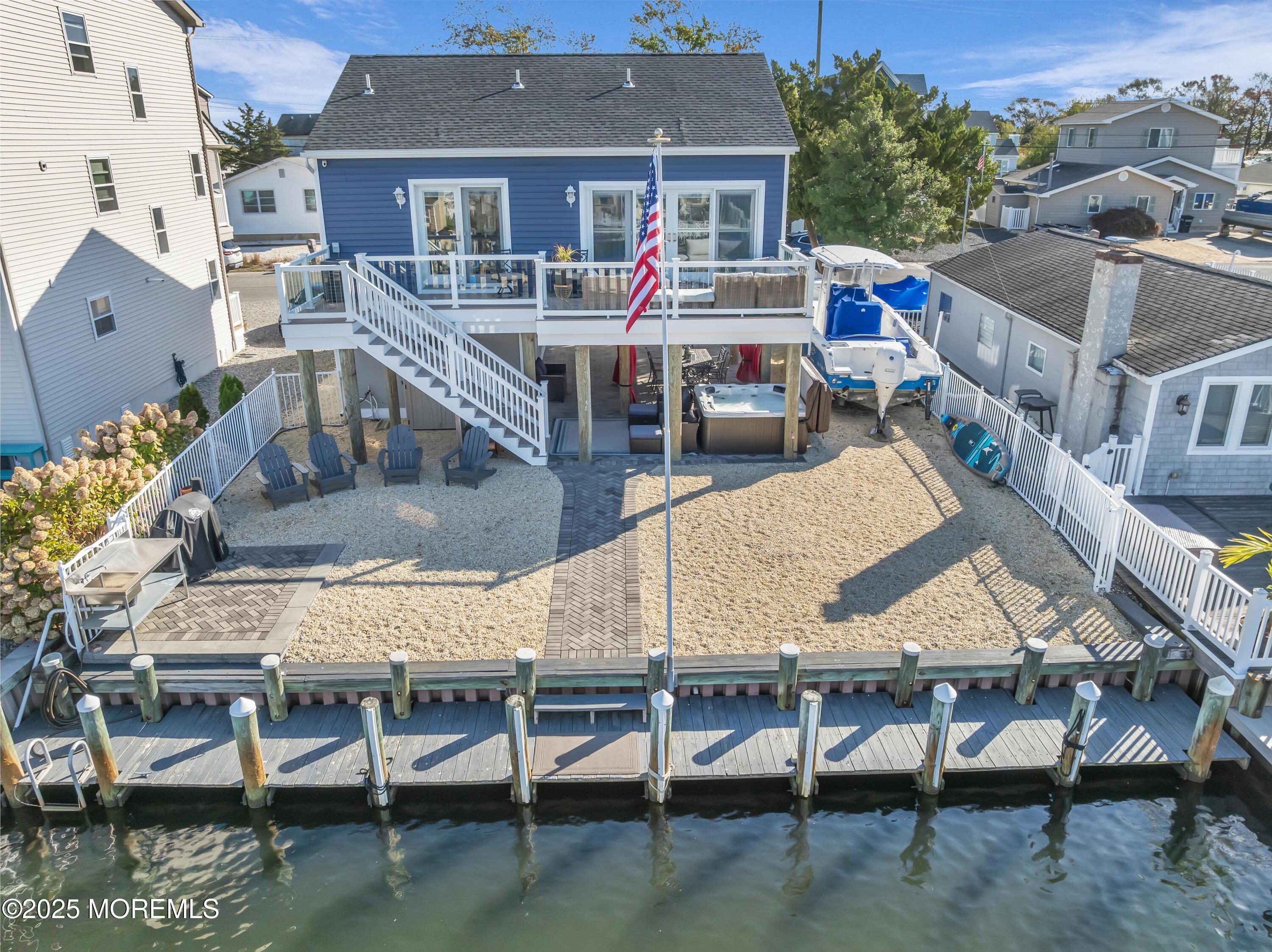 21 Compass Road Waretown, NJ 08758 - Photo 29 of 46 an aerial view of a house with swimming pool and sitting area