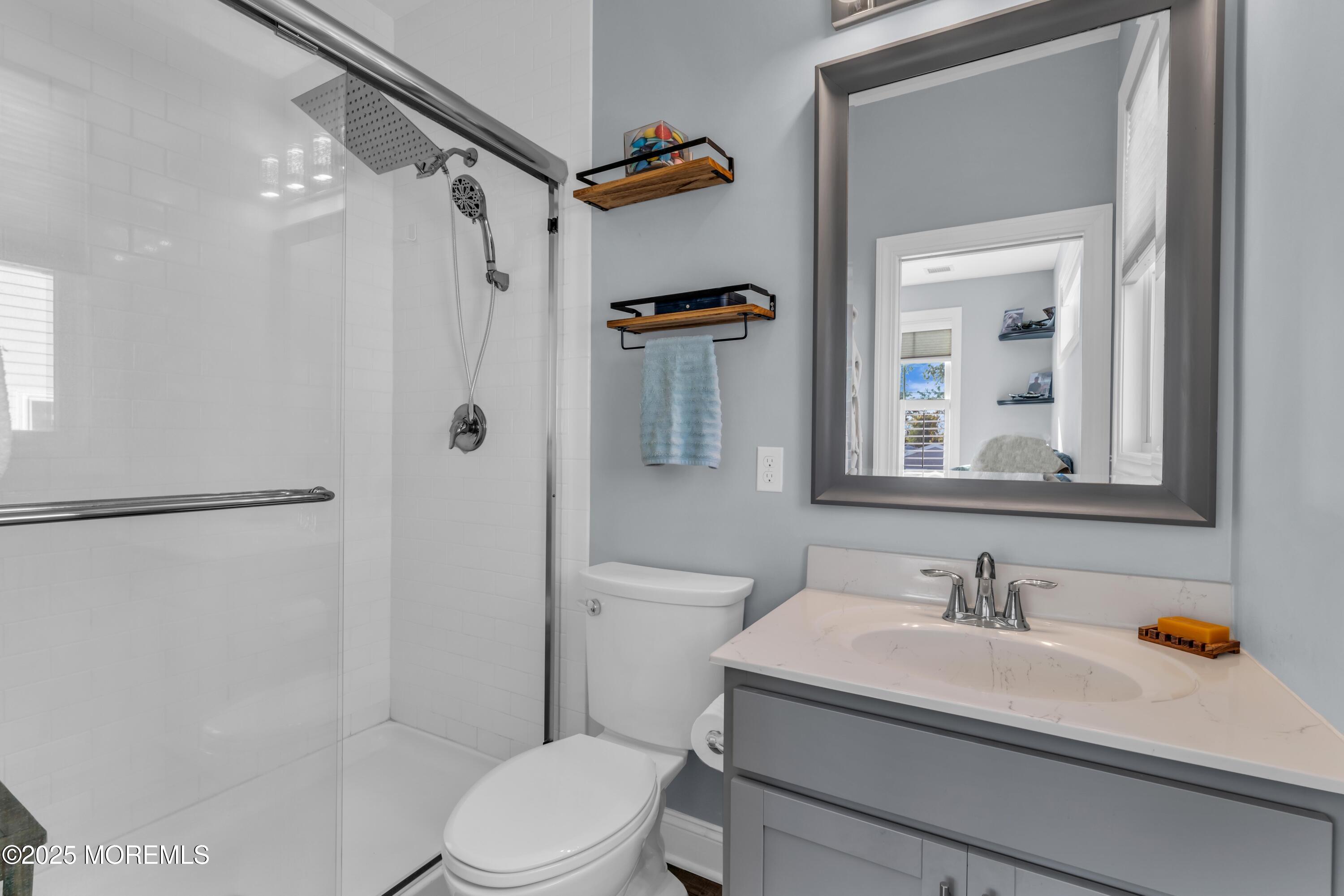 21 Compass Road Waretown, NJ 08758 - Photo 31 of 46 a bathroom with a sink toilet and shower