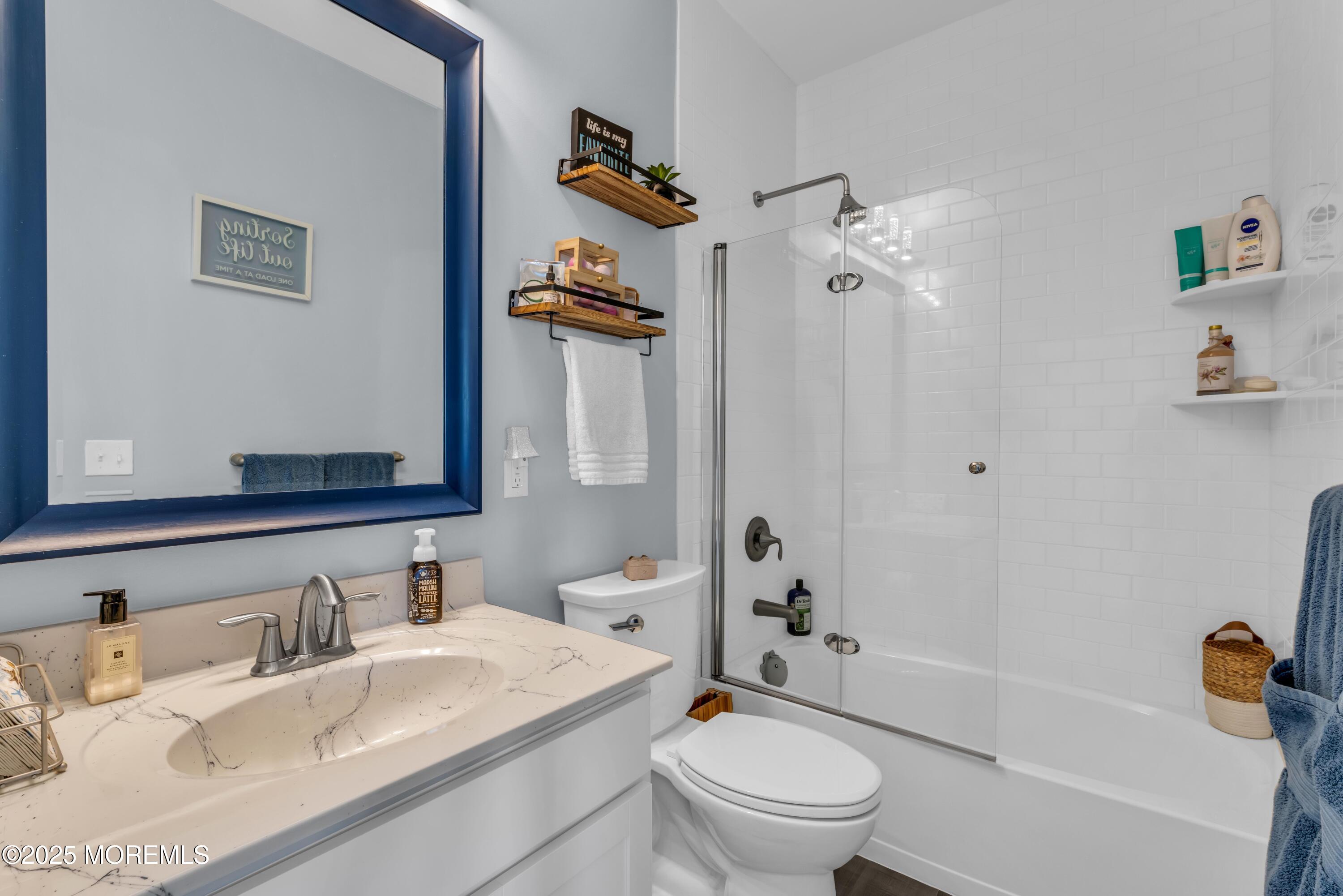 21 Compass Road Waretown, NJ 08758 - Photo 32 of 46 a bathroom with a granite countertop sink toilet and shower