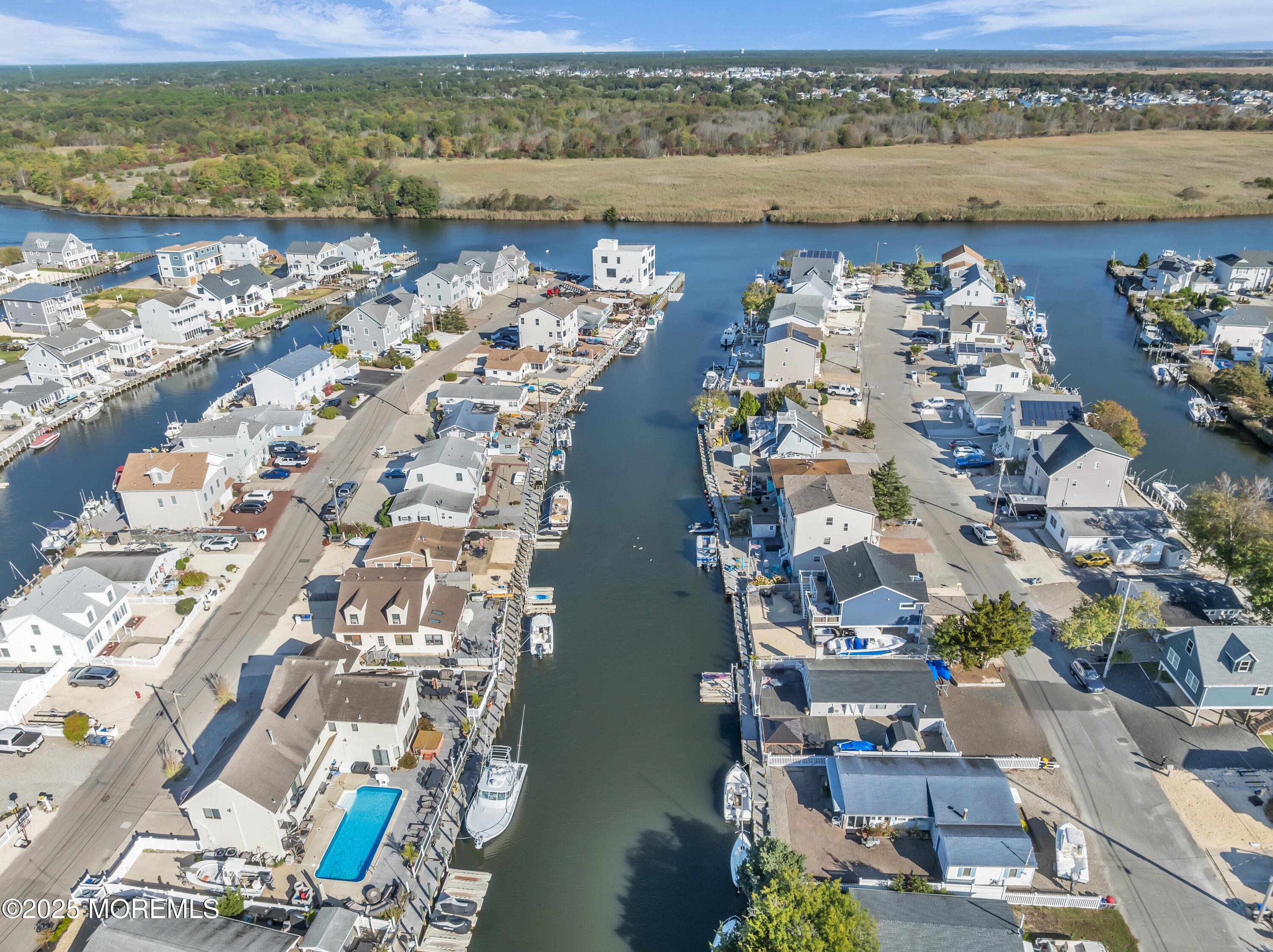 21 Compass Road Waretown, NJ 08758 - Photo 36 of 46 an aerial view of ocean and residential houses with outdoor space