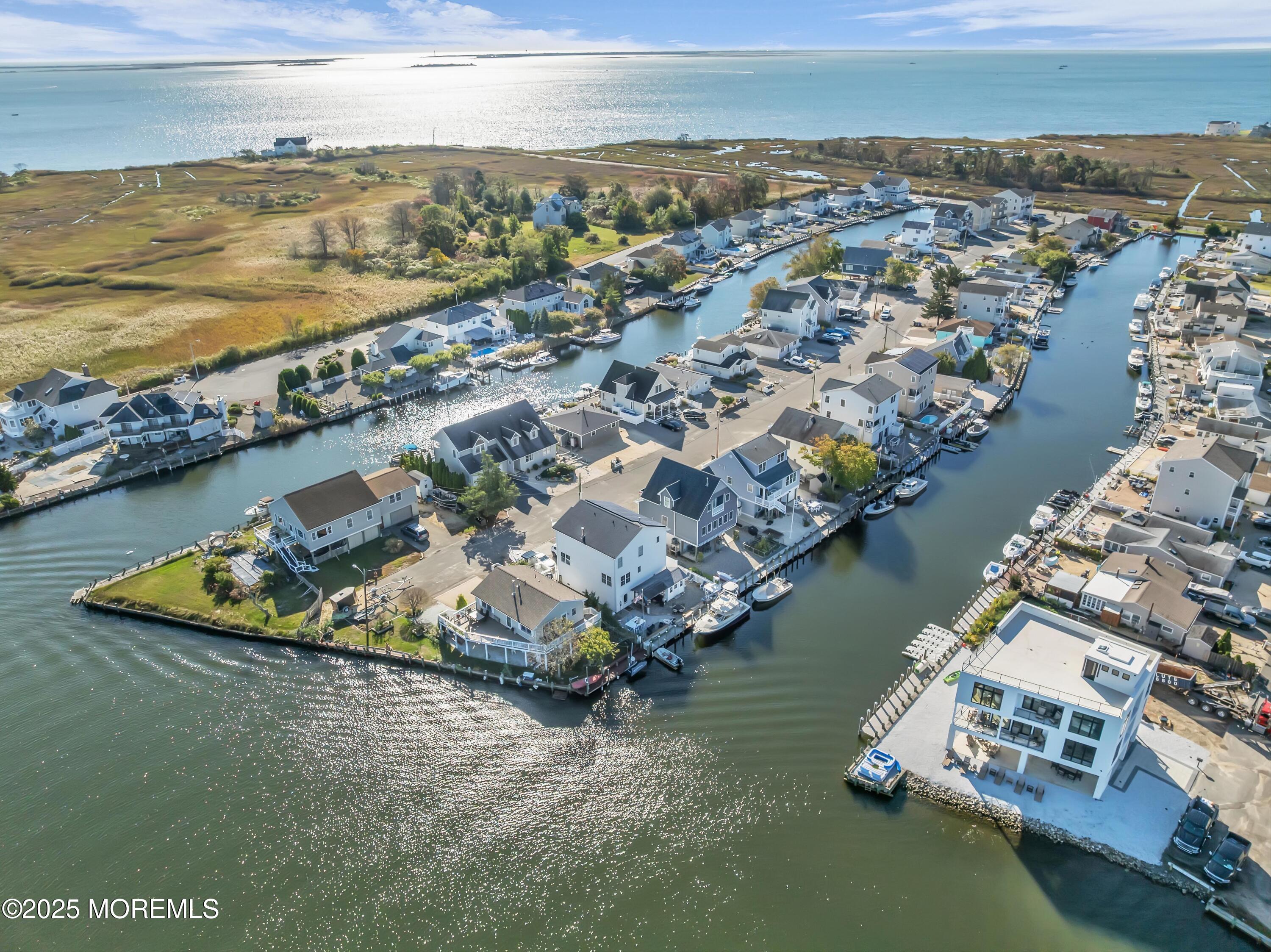 21 Compass Road Waretown, NJ 08758 - Photo 37 of 46 an aerial view of a house with a ocean view