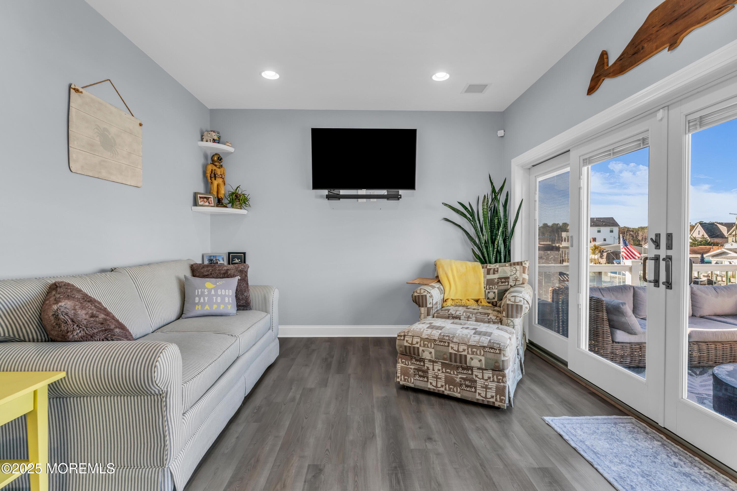 21 Compass Road Waretown, NJ 08758 - Photo 7 of 46 a living room with furniture and a flat screen tv